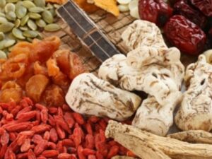 Dried Chinese herbs including Angelica Root and Knotgrass Herb from Health Embassy, illustrating traditional Chinese herbal medicine.