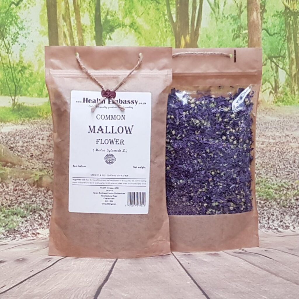 Dried Common Mallow Flowers from Health Embassy in a brown paper bag on a wooden surface with green natural background
