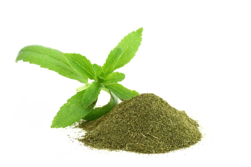 Natural Sweeteners. Stevia shoot. Next to it, there is a natural sweetener made of stevia.