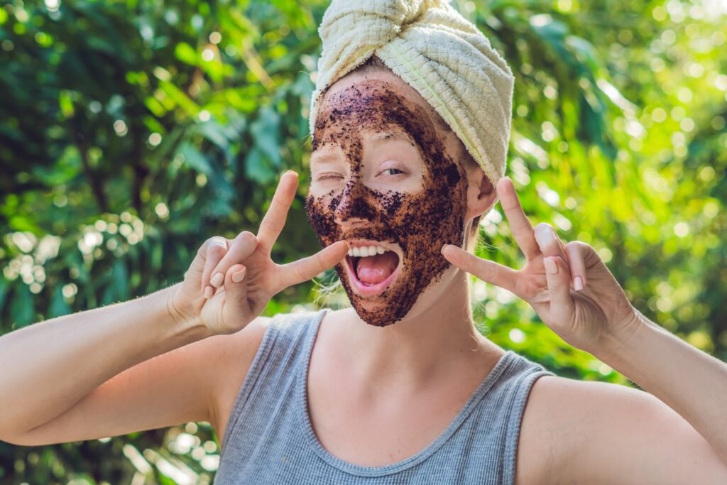 Woman exfoliating her skin with Health Embassy natural body scrubs for soft and radiant skin