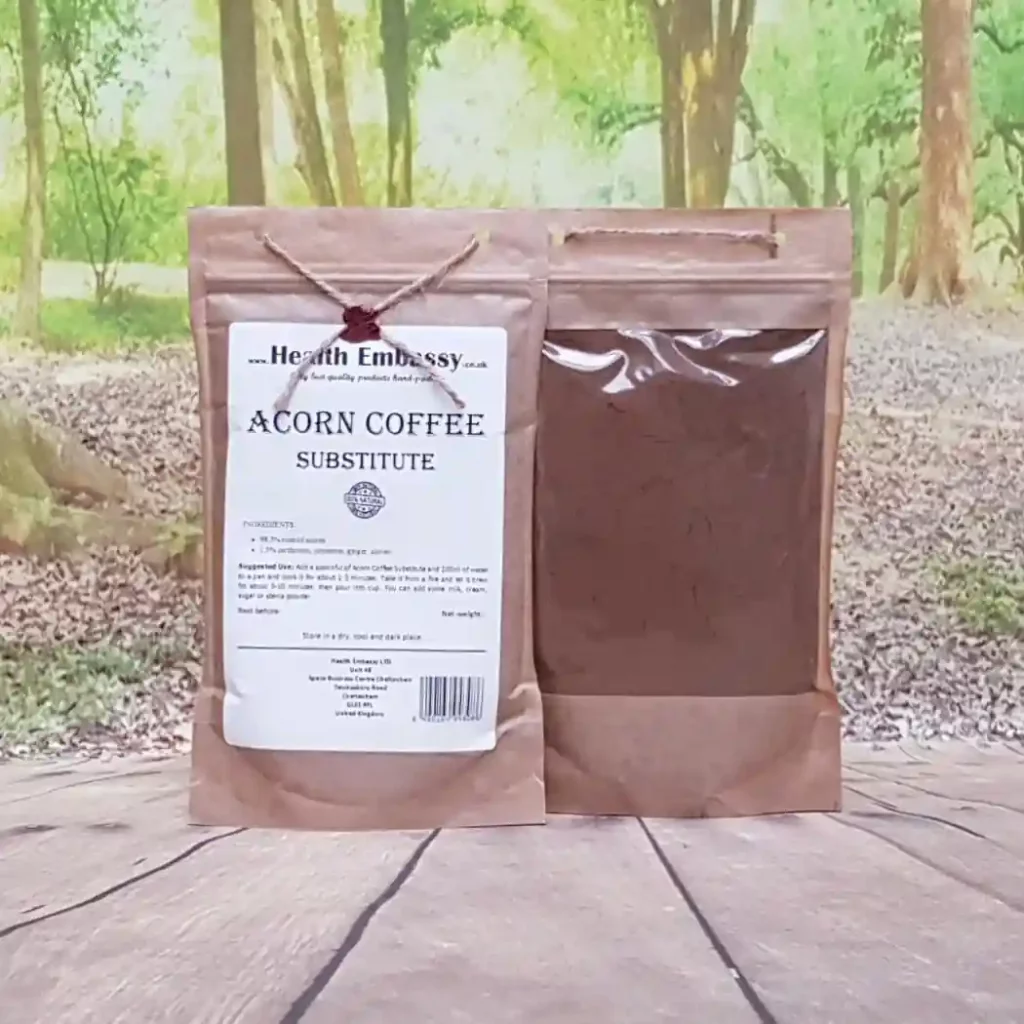 Acorn coffee substitute Health Embassy in two brown paper bags on a wooden surface.