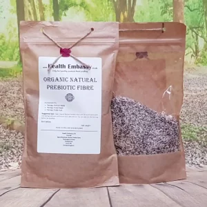 Organic Natural Prebiotic Fibre by Health Embassy in paper bag on wooden surface with green background