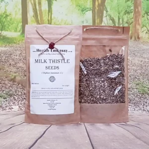 Milk Thistle Seeds Health Embassy in brown paper bag on wooden table with green background