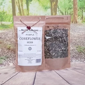 Paper bag filled with dried and cut Purple Coneflower Herb by Health Embassy placed on a wooden surface with a green natural background.