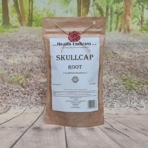 Skullcap Root in a brown paper bag with white label showing ingredients and usage instructions on a wooden surface – Health Embassy