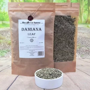 Damiana Leaf in two brown paper pouches and a white bowl on a wooden surface