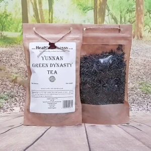 Close-up of Yunnan Green Dynasty Tea by Health Embassy loose leaves showing fresh green color and texture