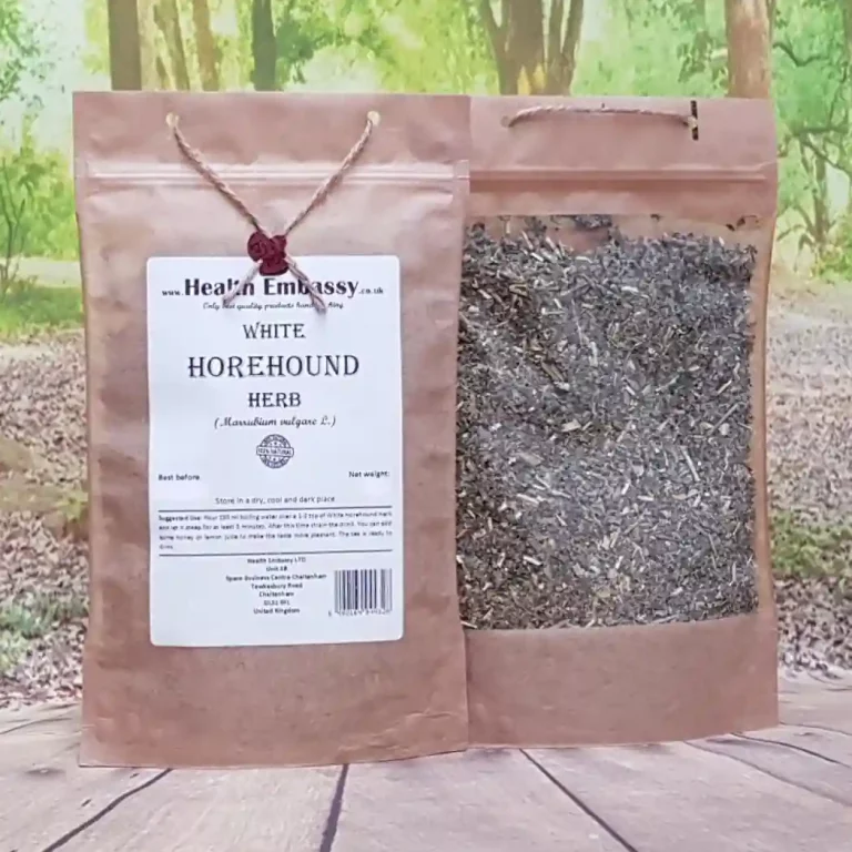 Dried and cut White Horehound Herb in a paper bag displayed on a wooden surface with a natural green background – Health Embassy.
